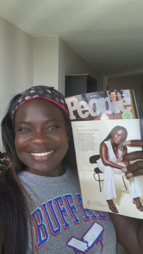 Dr. Raven Baxter holding the May 8, 2023 issue of People magazine open to her feature